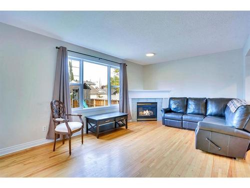 2266 Passchendaele Avenue Sw, Calgary, AB - Indoor Photo Showing Living Room With Fireplace