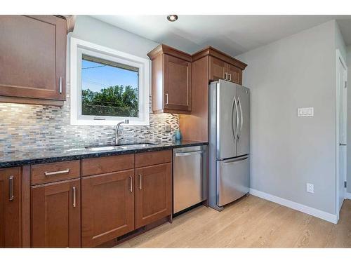 348 Adams Crescent Se, Calgary, AB - Indoor Photo Showing Kitchen With Stainless Steel Kitchen With Double Sink