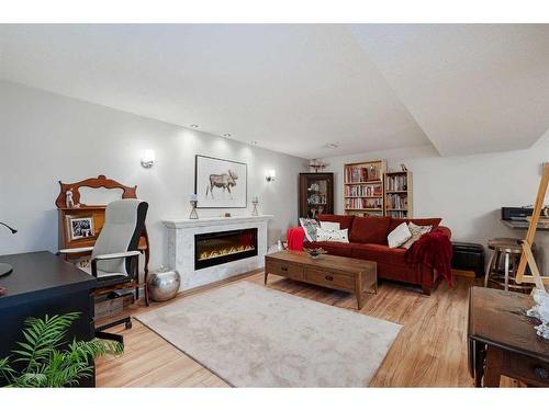 348 Adams Crescent Se, Calgary, AB - Indoor Photo Showing Living Room With Fireplace