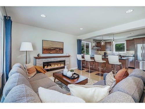 348 Adams Crescent Se, Calgary, AB - Indoor Photo Showing Living Room With Fireplace