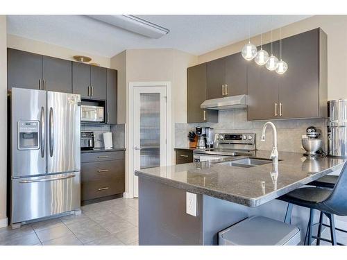 23 Everwoods Park Sw, Calgary, AB - Indoor Photo Showing Kitchen With Stainless Steel Kitchen With Double Sink With Upgraded Kitchen