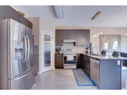 23 Everwoods Park Sw, Calgary, AB - Indoor Photo Showing Kitchen With Stainless Steel Kitchen