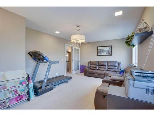 23 Everwoods Park Sw, Calgary, AB - Indoor Photo Showing Gym Room