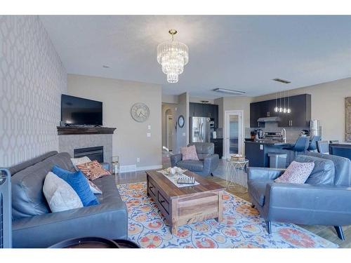 23 Everwoods Park Sw, Calgary, AB - Indoor Photo Showing Living Room With Fireplace