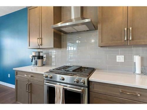 138 Baywater Way Sw, Airdrie, AB - Indoor Photo Showing Kitchen With Stainless Steel Kitchen With Upgraded Kitchen