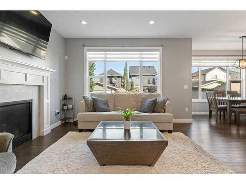 138 Baywater Way Sw, Airdrie, AB - Indoor Photo Showing Living Room With Fireplace