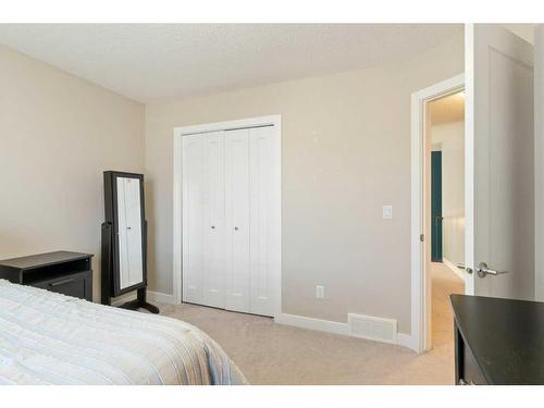 138 Baywater Way Sw, Airdrie, AB - Indoor Photo Showing Bedroom