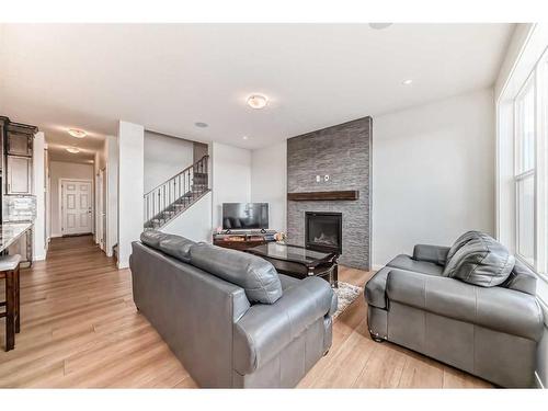 628 West Lakeview Dr Drive, Chestermere, AB - Indoor Photo Showing Living Room With Fireplace