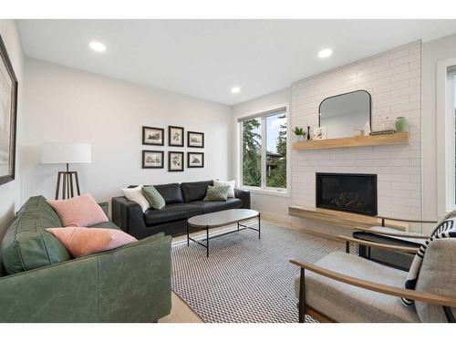 55 Shawnee Heath Sw, Calgary, AB - Indoor Photo Showing Living Room With Fireplace