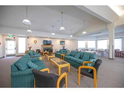 206-2206 Hawksbrow Point Nw, Calgary, AB - Indoor Photo Showing Living Room