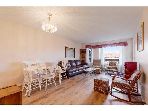 206-2206 Hawksbrow Point Nw, Calgary, AB - Indoor Photo Showing Living Room With Fireplace