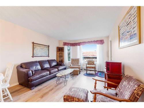 206-2206 Hawksbrow Point Nw, Calgary, AB - Indoor Photo Showing Living Room