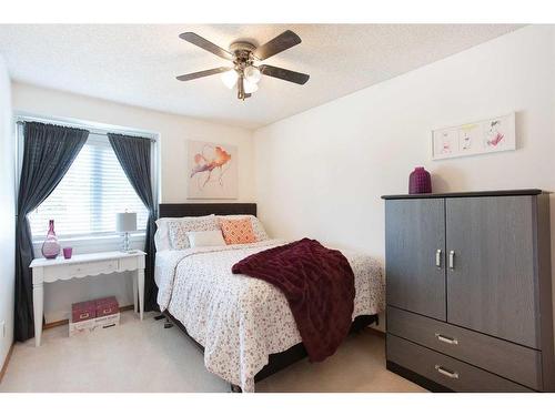 57 Shannon Crescent Sw, Calgary, AB - Indoor Photo Showing Bedroom