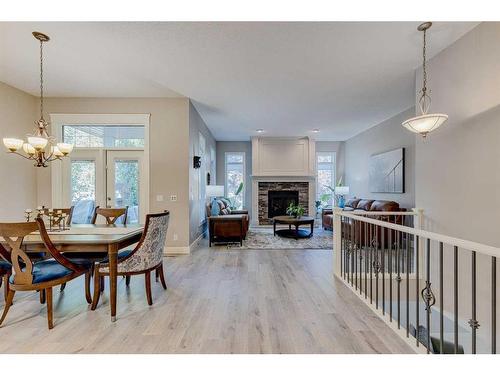 2 Elgin Park Common Se, Calgary, AB - Indoor Photo Showing Dining Room With Fireplace