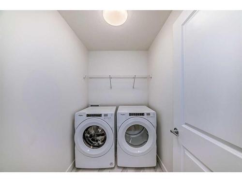 325 Baneberry Way Sw, Airdrie, AB - Indoor Photo Showing Laundry Room