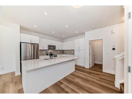 325 Baneberry Way Sw, Airdrie, AB - Indoor Photo Showing Kitchen With Stainless Steel Kitchen With Upgraded Kitchen