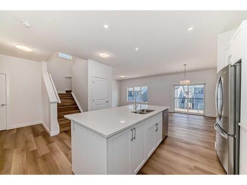 325 Baneberry Way Sw, Airdrie, AB - Indoor Photo Showing Kitchen With Double Sink