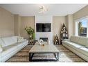 249 Walden Heights Se, Calgary, AB  - Indoor Photo Showing Living Room With Fireplace 