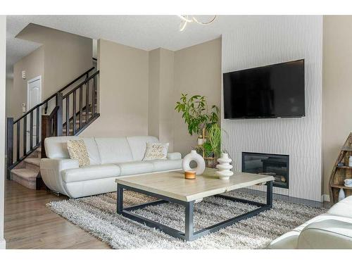 249 Walden Heights Se, Calgary, AB - Indoor Photo Showing Living Room With Fireplace