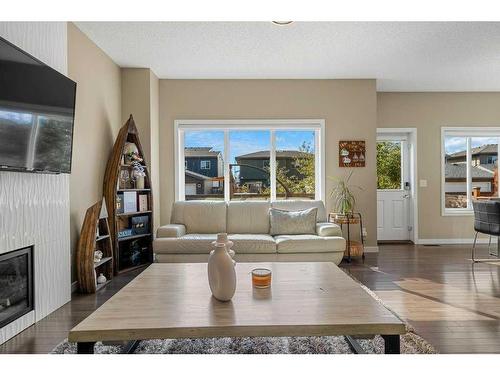 249 Walden Heights Se, Calgary, AB - Indoor Photo Showing Living Room With Fireplace