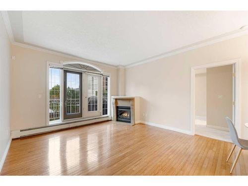 202-1315 12 Avenue Sw, Calgary, AB - Indoor Photo Showing Living Room With Fireplace