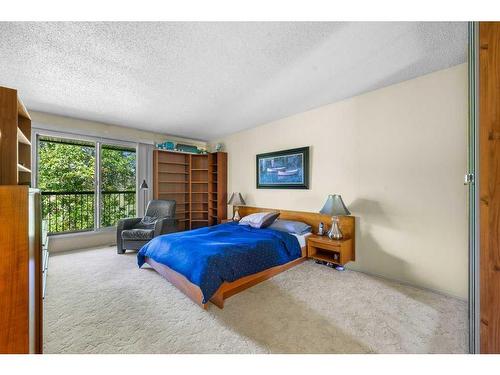 419-3131 63 Avenue Sw, Calgary, AB - Indoor Photo Showing Other Room With Fireplace