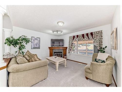 231 Valley Brook Circle Nw, Calgary, AB - Indoor Photo Showing Living Room With Fireplace