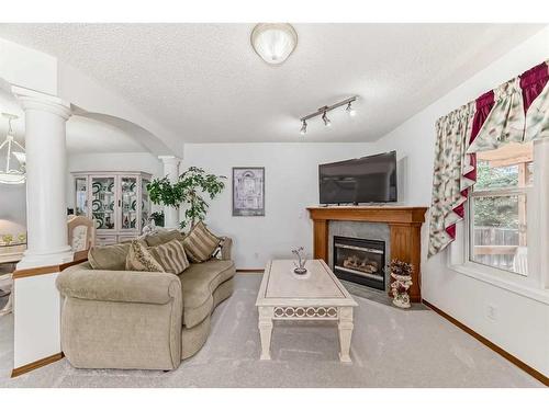 231 Valley Brook Circle Nw, Calgary, AB - Indoor Photo Showing Living Room With Fireplace