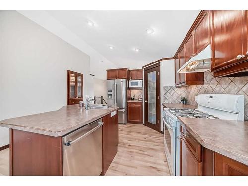 108 Sunset Heights, Crossfield, AB - Indoor Photo Showing Kitchen With Double Sink