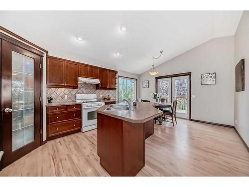 108 Sunset Heights, Crossfield, AB - Indoor Photo Showing Kitchen With Double Sink