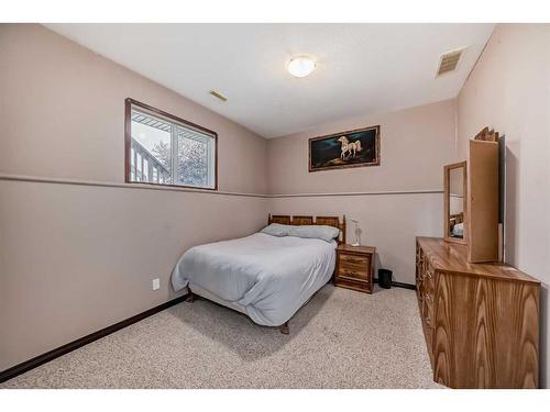 108 Sunset Heights, Crossfield, AB - Indoor Photo Showing Bedroom