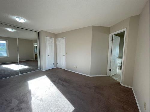 56 Coachway Gardens Sw, Calgary, AB - Indoor Photo Showing Other Room