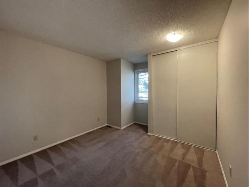 56 Coachway Gardens Sw, Calgary, AB - Indoor Photo Showing Other Room