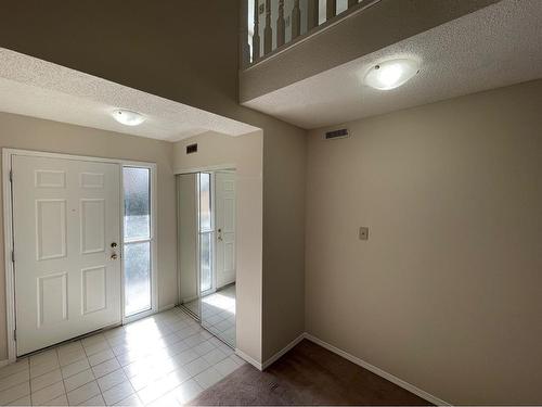 56 Coachway Gardens Sw, Calgary, AB - Indoor Photo Showing Other Room