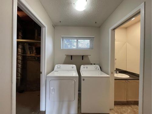 56 Coachway Gardens Sw, Calgary, AB - Indoor Photo Showing Laundry Room