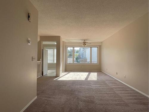 56 Coachway Gardens Sw, Calgary, AB - Indoor Photo Showing Other Room