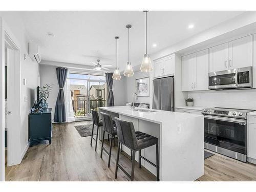 4210-200 Seton Circle Se, Calgary, AB - Indoor Photo Showing Kitchen With Stainless Steel Kitchen With Upgraded Kitchen