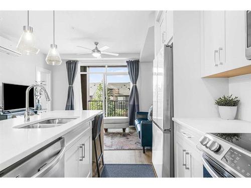 4210-200 Seton Circle Se, Calgary, AB - Indoor Photo Showing Kitchen With Stainless Steel Kitchen With Double Sink With Upgraded Kitchen