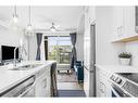 4210-200 Seton Circle Se, Calgary, AB  - Indoor Photo Showing Kitchen With Stainless Steel Kitchen With Double Sink With Upgraded Kitchen 