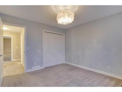 15 Sunset Close, Cochrane, AB - Indoor Photo Showing Other Room