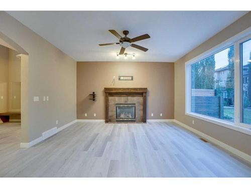 15 Sunset Close, Cochrane, AB - Indoor Photo Showing Living Room With Fireplace