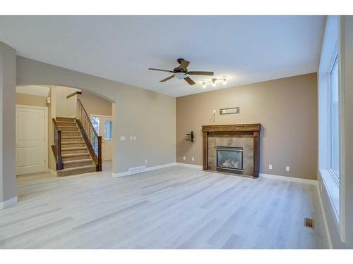 15 Sunset Close, Cochrane, AB - Indoor Photo Showing Living Room With Fireplace