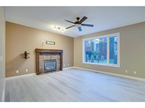 15 Sunset Close, Cochrane, AB - Indoor Photo Showing Living Room With Fireplace