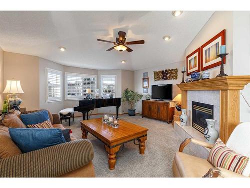 134 Tuscarora Close Nw, Calgary, AB - Indoor Photo Showing Living Room With Fireplace