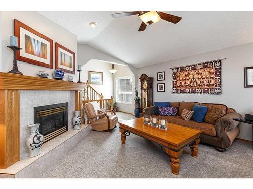 134 Tuscarora Close Nw, Calgary, AB - Indoor Photo Showing Living Room With Fireplace