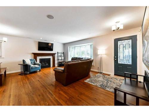 1267 Lake Sundance Crescent Se, Calgary, AB - Indoor Photo Showing Living Room With Fireplace