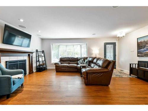 1267 Lake Sundance Crescent Se, Calgary, AB - Indoor Photo Showing Living Room With Fireplace