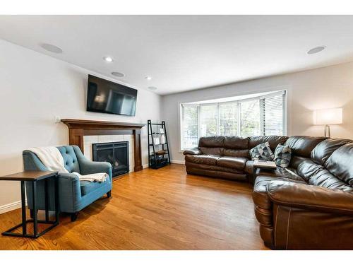 1267 Lake Sundance Crescent Se, Calgary, AB - Indoor Photo Showing Living Room With Fireplace