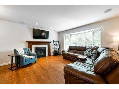 1267 Lake Sundance Crescent Se, Calgary, AB - Indoor Photo Showing Living Room With Fireplace