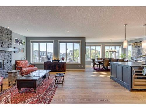 165 Aspen Summit Circle Sw, Calgary, AB - Indoor Photo Showing Living Room With Fireplace